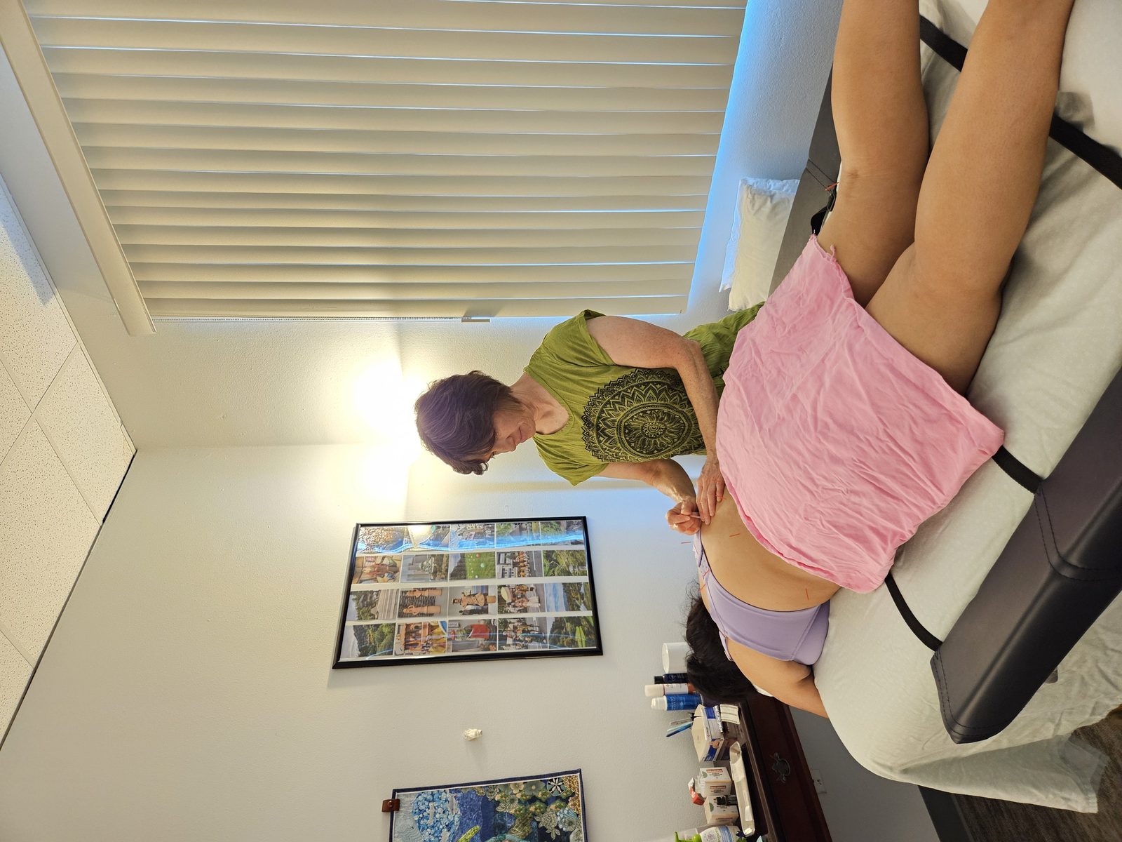 Dr. Lisa Grant treating a patient with acupuncture at Spring Mountains Acupuncture in Las Vegas.